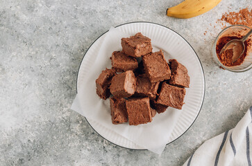 Raw vegan chocolate fudge. Healthy vegan food concept.