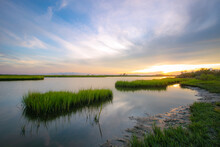 Sunset Reflection With Marsh Grass Waterway On The Coast 