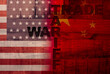 USA and China flag printed on wooden background .It is symbol of economic tariffs trade war and tax barrier between United States of America and China.
