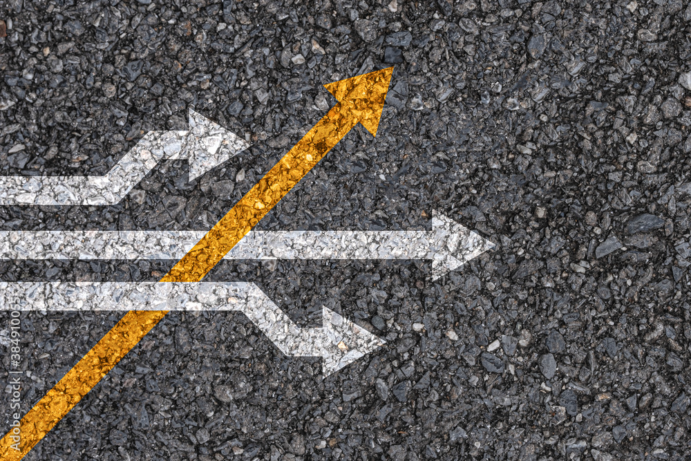 Different thinking and Business and technology disruption concept , Yellow arrow cross direction with white arrow on road asphalt. - obrazy, fototapety, plakaty 