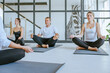 © lithiumphoto - Yoga class of young people group indoor