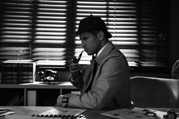 Wall Mural - Old fashioned detective with smoking pipe at table in office. Black and white effect