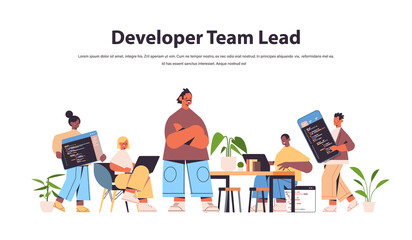 Wall Mural - team lead engineer with mix race web developers coding together creating program code development of