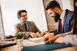 © Mediteraneo - Meeting with agent in office, buying renting apartment or house, buyers of real estate ready to conclude a deal.