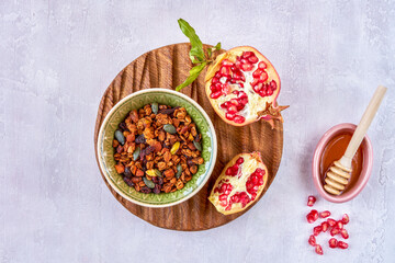 Poster - Homemade granola with honey and pomegranate. Top view