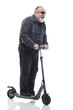 © ASDF - in full growth. an elderly man with an electric scooter