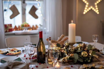 A table set for dinner meal at Christmas time.