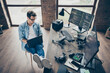 © deagreez - Above high angle view of his he nice attractive focused guy geek expert working remotely typing coding calculating game development dev at modern industrial home office work place station