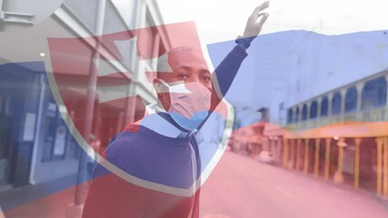 Canvas Print - Slovakian flag waving against man wearing face mask hailing a taxi