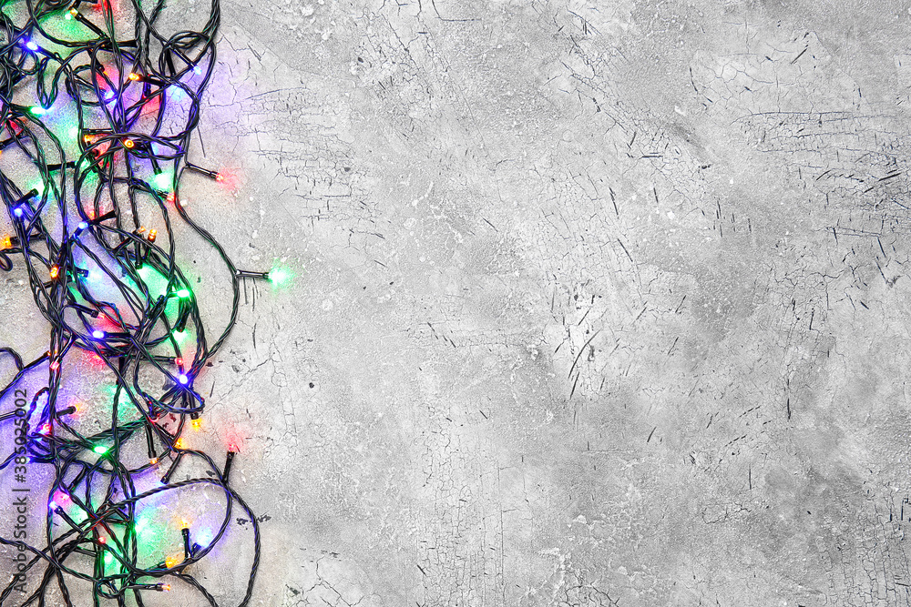 Christmas lights on grey background