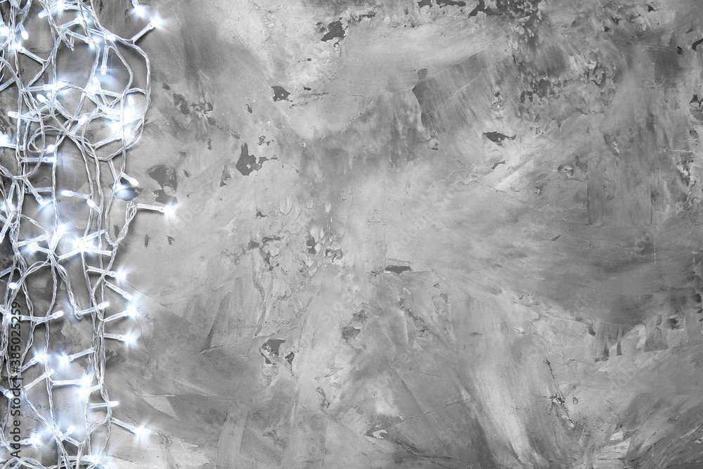Christmas lights on grey background