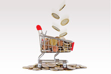 Shopping Cart With Falling Euro Coins  - Concept Of Shopping And Economy