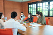 © Burin - Asian business people wear face mask meeting in new normal office