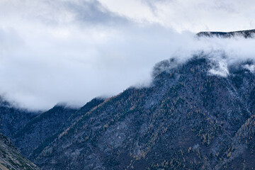 panoramic view of picturesque snowy mountains tops on blue sky background