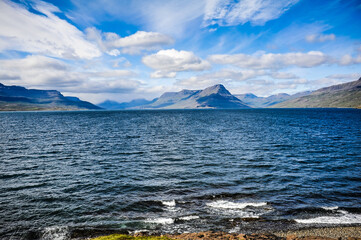 Beautiful Icelandic landscape, volcanic mountains and beautiful clouds.