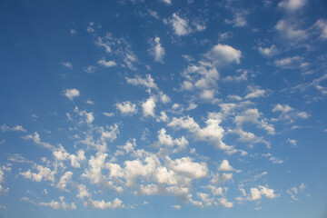 Panoramic view of a beautiful blue sky with fluffy white clouds. Cloudcape. Nature Air. Seasonal concept for product presentation and wallpaper with space for your text.