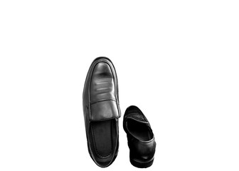 A pair of formal male shoes kept against a white background.