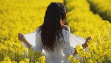 Hot Woman Takes Off Dress In Rapeseed Field
