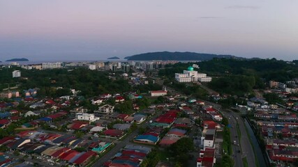 Wall Mural - Aerial Footage of local lifestyle residential housing during twilight sunset at Kota Kinabalu city, Sabah, Malaysia