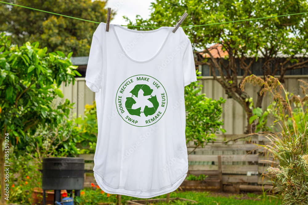 T shirt on washing line with circular economy textiles icon, make, use, reuse, swap, donate, recycle with eco clothes recycle icon sustainable fashion concept - obrazy, fototapety, plakaty 