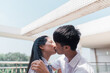 © Pansfun Images/Stocksy - Young Asian college couple kissing