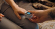 © Danil Nevsky/Stocksy - Couple using pulse oximeter at home