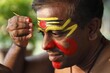 © imageBROKER - Kathakali dancer doing his make up, Chuvanna Thaadi mask, Kerala, southern India, Asia
