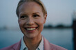 © Joseffson/Westend61 - Close-up of smiling beautiful female entrepreneur looking away at dusk