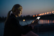 © Joseffson/Westend61 - Confident businesswoman using digital tablet at dusk