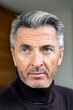 © dirk moll fotografie/Westend61 - Close-up of confident mature businessman looking away in office
