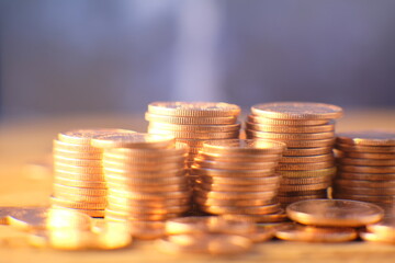 Stack of golden coins on black background and Advertising coins of finance and banking,Increasing columns of gold coins on table