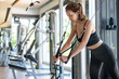 © marchsirawit - Woman arms doing cable fly exercise in gym.