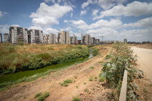 Ganei Ayalon Neighborhood At The Entrance To Moshav Ahisamakh And A55 Stream That Flows Near The Neighborhood, New Buildings Against A Background Of Cloudy Skies
