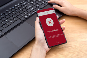 Female using mobile phone online payment failed on red screen, declined transaction invalid purchase. payment failed error try again, Concept banking online shopping mobile payment.