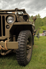 Close up of world war 2 jeep - wheel and headlight