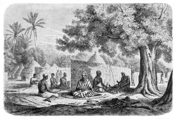 black Senegal people listen to chief crouched on a carpet outdoor in traditional dress. Ancient grey tone etching style art by B�rard, published on Le Tour du Monde, Paris, 1861