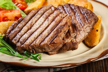 Wall Mural - Succulent portions of grilled fillet mignon served with baked potatoes