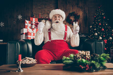 Shocked Grey Beard Santa Claus Sit Cozy Couch Watch X-mas Christmas Cinema Film Impressed Drink Milk Glass Eat Gingerbread Cookie Wear Red Cap Headwear In House Indoors Noel Ornament