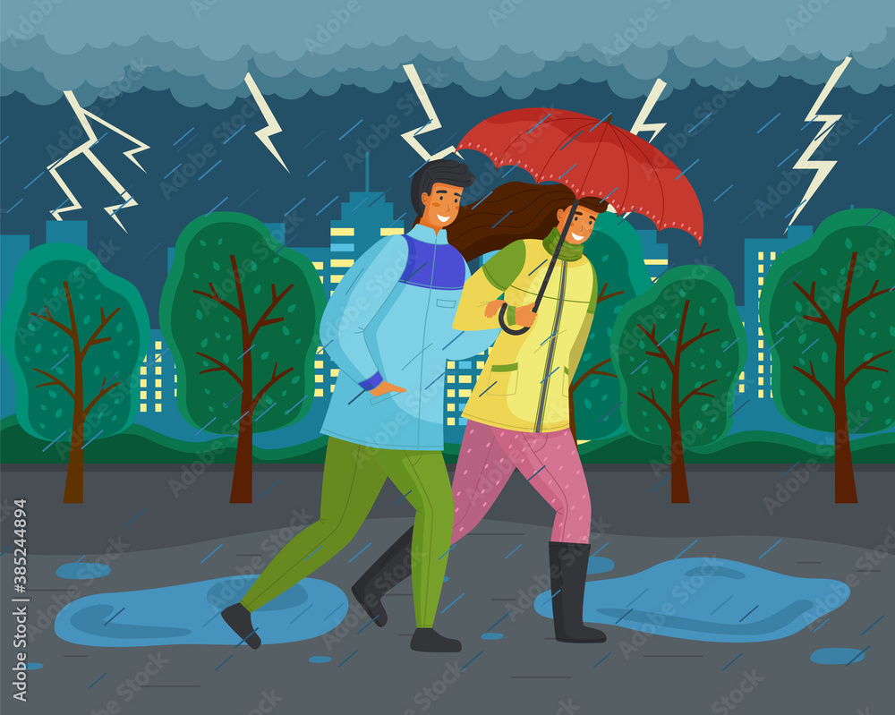 Family walks in autumn park. Girl in yellow puffer jacket, guy wears blue windbreaker, carries red umbrella. Fall landscape, lightning, ominous atmosphere. Dark landscape. Terrible lousy weather - obrazy, fototapety, plakaty 