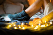 © Melinda Nagy - cozy Christmas at home woman in wool socks in bed eating cookies
