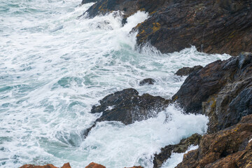 waves crashing on rocks