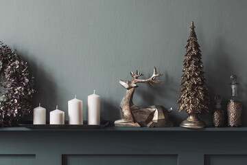 Christmas composition on the shelf in the living room interior. Beautiful decoration. Christmas trees, candles, stars, light and elegant accessories. Merry Christmas and Happy Holidays, Template.