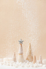 Wall Mural - Christmas or New Year background decorated with Christmas tree of waffle cones and falling snow of sugar