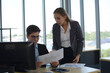 © jpjengs - Business people sitting at desk and working with laptop computer.