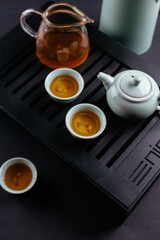 Wall Mural - Chinese tea ceremony on a black background