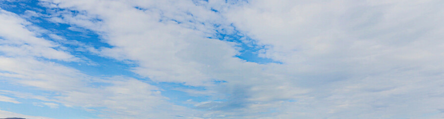 Wall Mural - Image of a partly cloudy and partly clear sky during the day