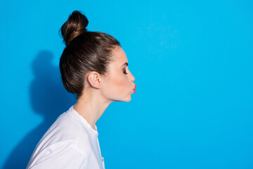 Sticker - Close-up profile side view portrait of her she nice-looking attractive pretty lovely sweet affectionate cute girl pout lips sending air kiss isolated on bright vivid sine vibrant blue color background