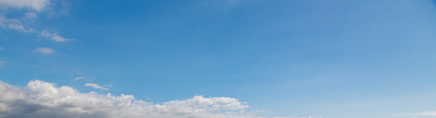Wall Mural - Image of a partly cloudy and partly clear sky during the day