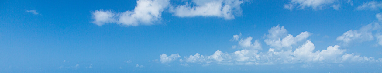 Wall Mural - Image of a partly cloudy and partly clear sky during the day