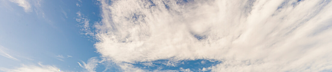 Wall Mural - Image of a partly cloudy and partly clear sky during the day